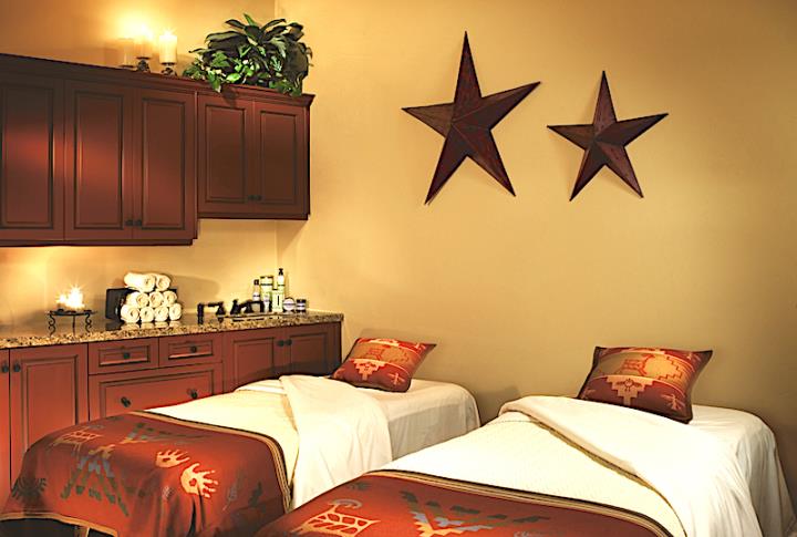 Two spa beds in dim lit room